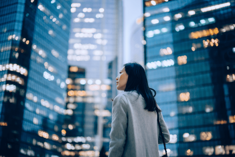 Woman standing in city.